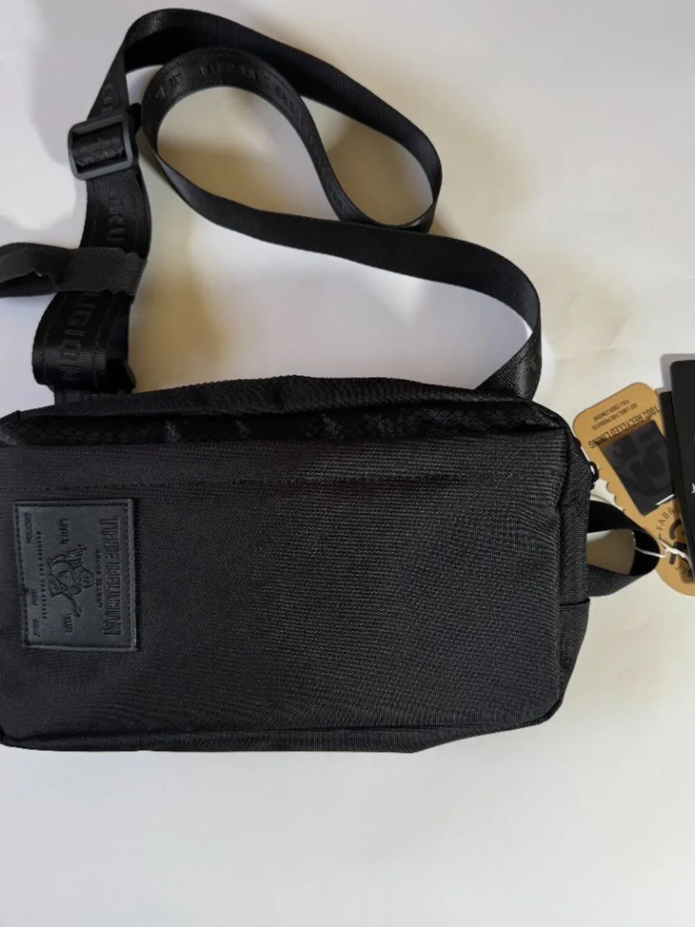 True Religion Balck Crossbody Sling Bag Ajustable logo Strap Rubber Patch Logo